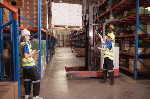 side view warehouse workers discussing